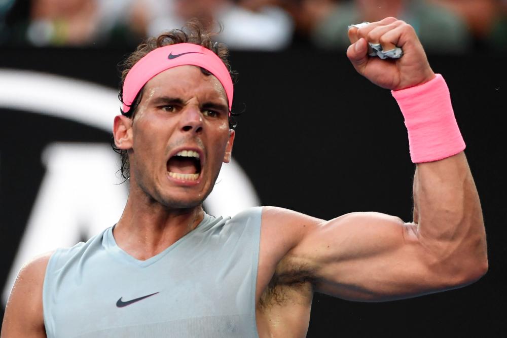 Spain's Rafael Nadal reacts after a point against Argentina's Diego Schwartzman during their men's singles fourth round match on day seven of the Australian Open tennis tournament in Melbourne on Jan 21, 2018. — AFP