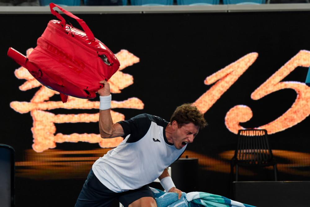 Spain's Pablo Carreno Busta reacts after losing to Japan's Kei Nishikori during their men's singles match on day eight of the Australian Open tennis tournament in Melbourne on Jan 21, 2019. — AFP