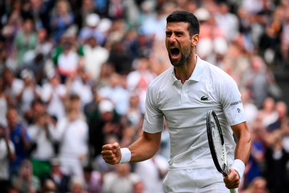 Serbia’s Novak Djokovic celebrates winning against Russia’s Andrey Rublev during their men’s singles quarter-finals tennis match on the ninth day of the 2023 Wimbledon Championships at The All England Tennis Club in Wimbledon, southwest London, on July 11, 2023. AFPPIX