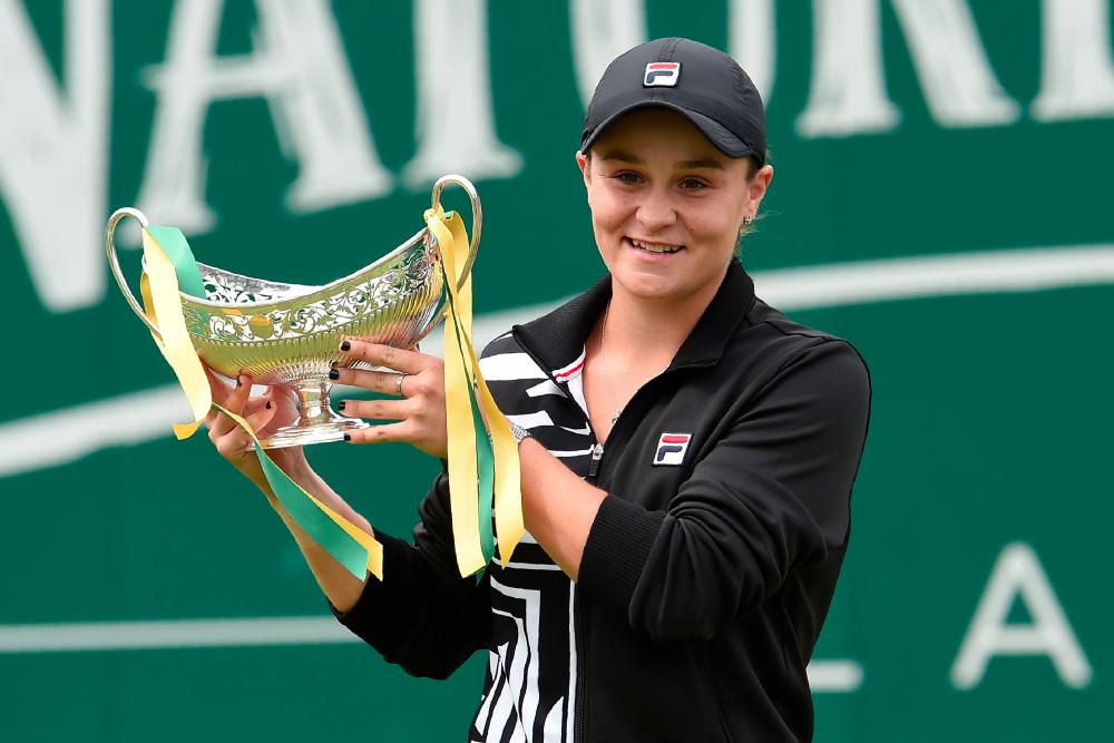Australia's Ashleigh Barty poses for a photograph with the trophy after her straight sets victory over Germany's Julia Gorges in their women's singles final tennis match at the WTA Nature Valley Classic tournament at Edgbaston Priory Club in Birmingham, central England on June 23, 2019. — AFP
