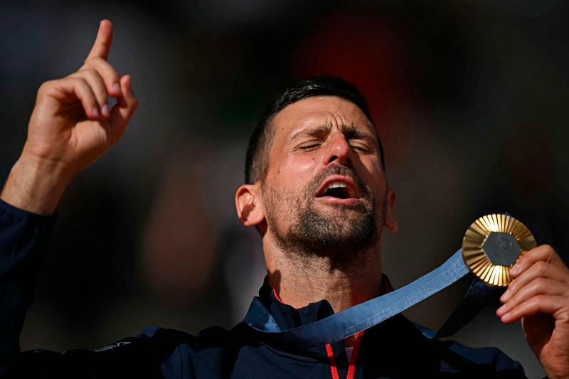 Gold medallist, Serbia’s Novak Djokovic poses with his medal on the podium at the presentation ceremony for the men’s singles tennis event on Court Philippe-Chatrier at the Roland-Garros Stadium during the Paris 2024 Olympic Games - AFPpix