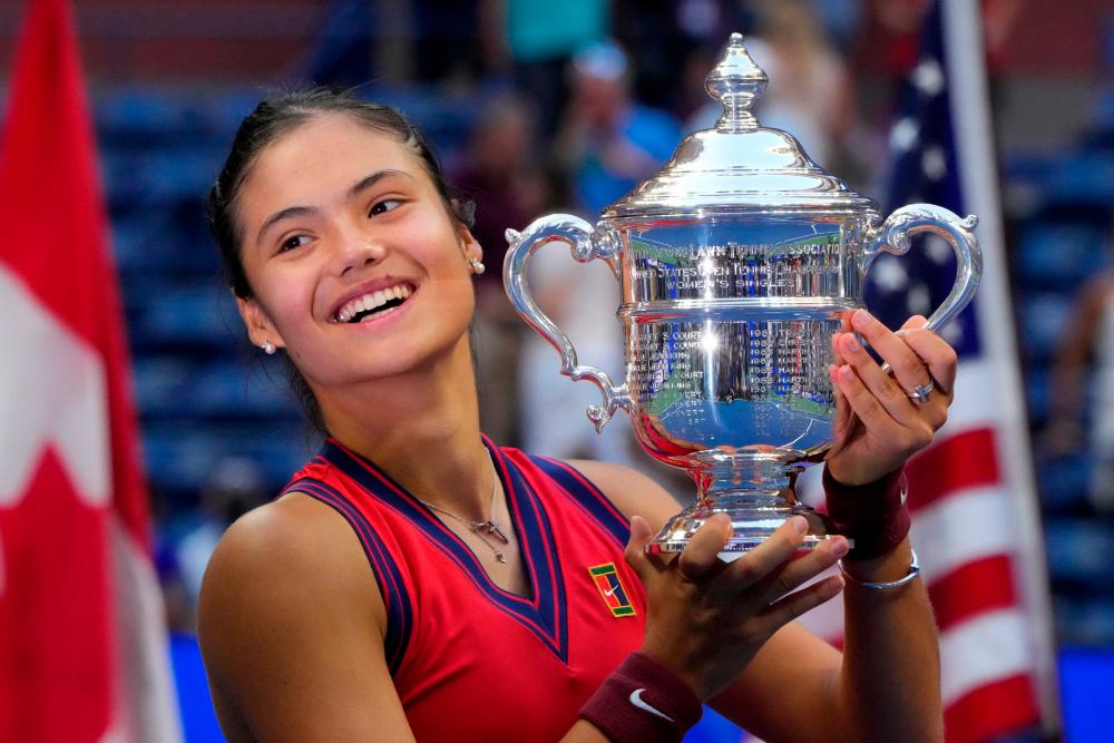 Raducanu celebrates with the trophy after winning the 2021 US Open Tennis tournament women’s final match against Fernandez at the USTA Billie Jean King National Tennis Center in New York. – AFPPIX