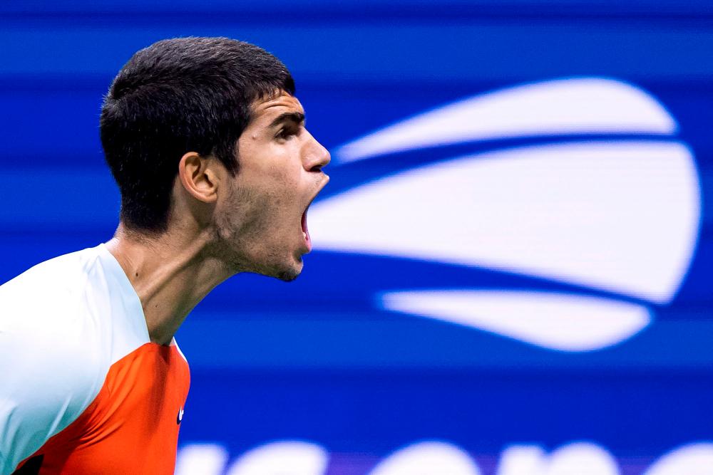 Spain’s Carlos Alcaraz reacts after a point during his 2022 US Open Tennis tournament men’s singles quarter-final match against Italy’s Jannik Sinner at the USTA Billie Jean King National Tennis Center in New York, on September 7, 2022. AFPPIX