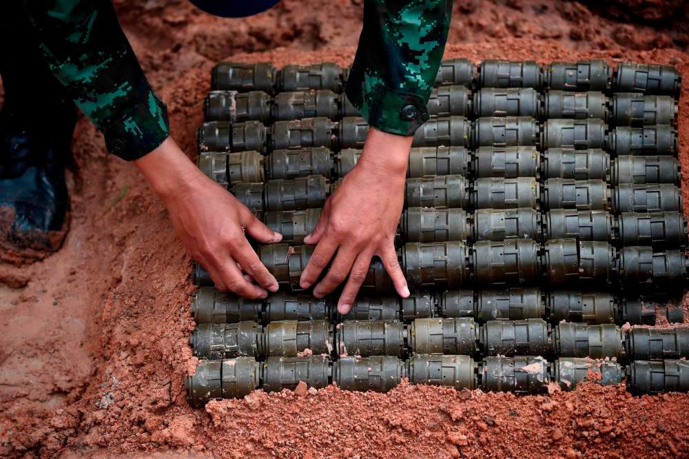 For representational purposes only - A soldier stacks anti-personnel mines before a controlled detonation at the official Destruction Ceremony of Thailand’s Retained Anti-Personnel Mines 2019 event by the Royal Thai Armed Forces in the western Thai province of Sa Kaeo on Aug 6, 2019. — AFP