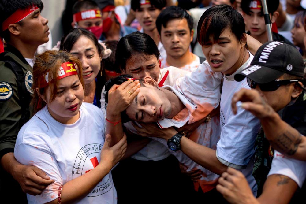 Protesters perform during a demonstration outside the Embassy of Myanmar in Bangkok on February 1, 2023, to mark the second anniversary of the coup in Myanmar. AFPPIX