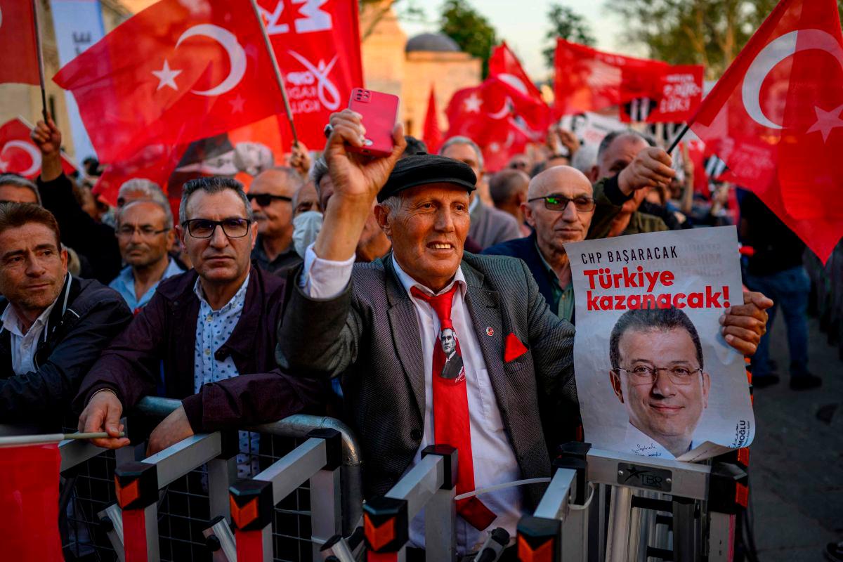 People hold Turkish flags and placards reading ‘winner Turkey’ as they take part in a demonstration against the detention of the Mayor of Istanbul, Ekrem Imamoglu, organised by the country’s main opposition, the Republican People’s Party (CHP), at Beyazid Square, in Istanbul, 07 May 2025. AFPpix