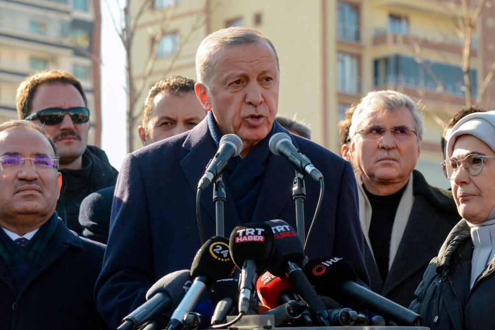 Turkish President Recep Tayyip Erdogan talks to the press during his visit to the hard-hit southeastern Turkish city of Diyarbakir, five days after a 7.8 magnitude earthquake struck the border region of Turkey and Syria, on February 11, 2023/AFPPix
