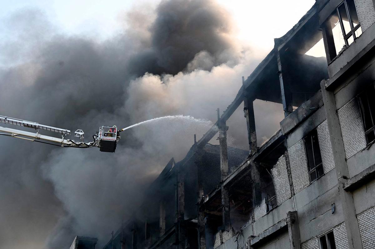 A firefighter extinguishes a fire at a civilian plant following Russian powerful attacks on the Ukrainian city of Kharkiv early on June 7, 2025. AFPpix