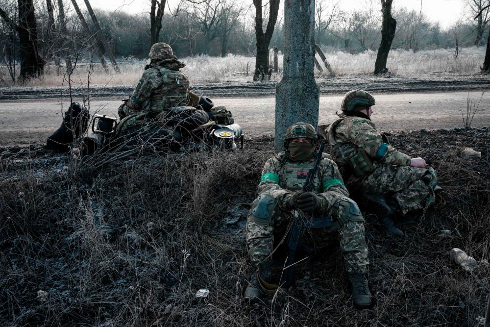 Ukrainian paratroopers wait for transport along the road in Chasiv Yar on January 28, 2023, amid the Russian invasion of Ukraine. AFPPIX