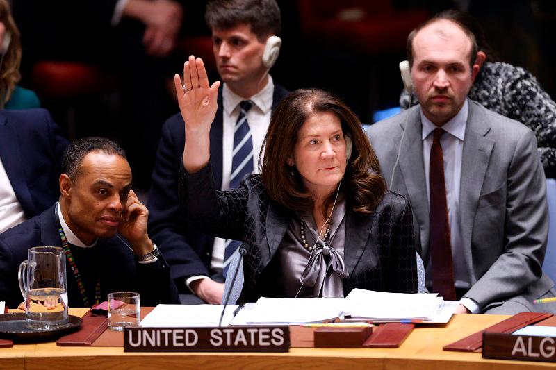 US Deputy Ambassador to the UN, Dorothy Shea, votes during a UN Security Council meeting on a US resolution on Ukraine on the third anniversary of Russia's invasion of Ukraine, at UN Headquarters in New York on February 24, 2025. The Security Council adopted the US resolution on Ukraine that was supported by Russia and contained no criticism of Moscow's aggression on the third anniversary of its invasion. There were 10 votes in favor and none against, but five abstentions including France and Britain which could have vetoed the resolution that merely implores a swift end to the conflict without blaming Russia. - CHARLY TRIBALLEAU / AFP