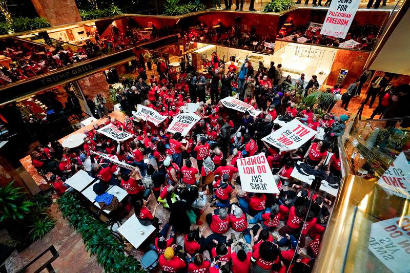 Demostrators from the human rights organiztaion Jewish Voice for Peace holds a civil disobedience action inside Trump Tower in New York on March 13, 2025. - AFPPIX