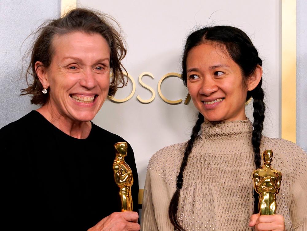 Producers Frances McDormand and Chloe Zhao, hold the Oscar for Best Picture for “Nomadland” as they pose in the press room at the Oscars on April 25, 2021, at Union Station in Los Angeles. McDormand also won for Actress in a Leading Role for “Nomadland” and Chloe Zhao won Directing for “Nomadland” - AFP