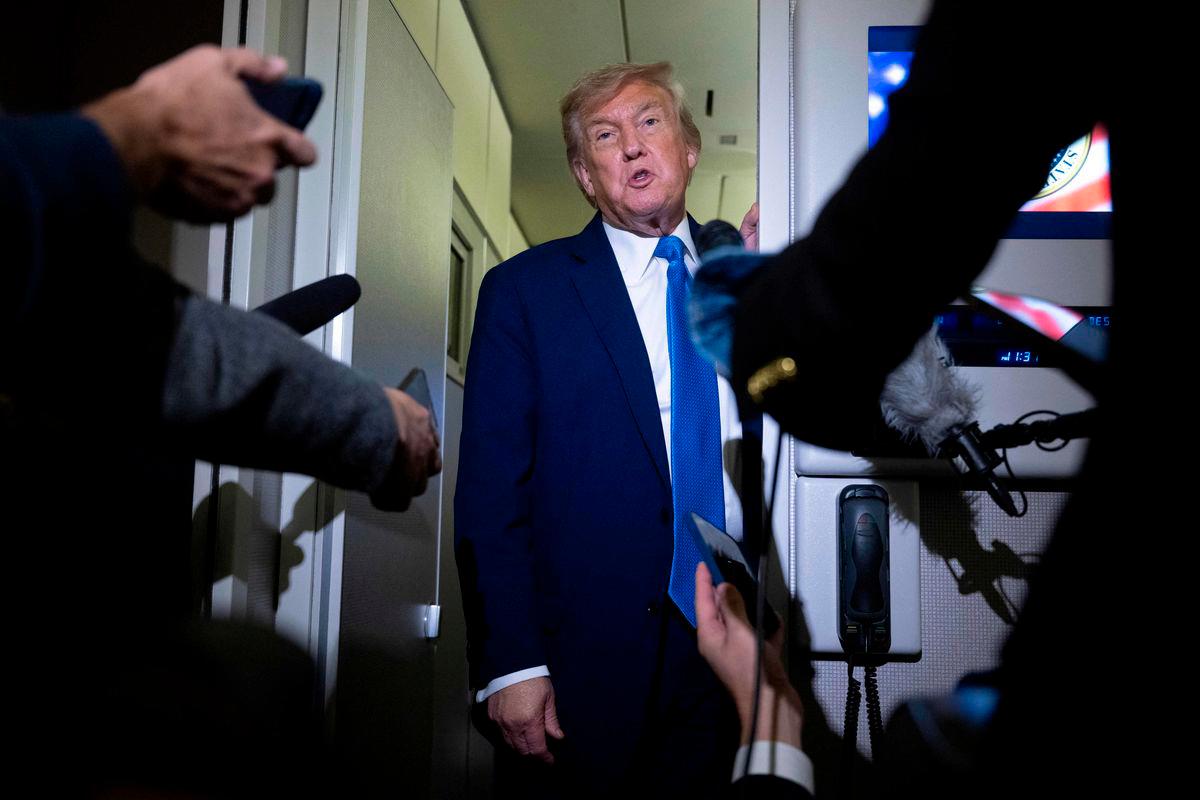 US President Donald Trump speaks to reporters about the G7 Summit aboard Air Force One while travelling back to Washington from Canada on June 16, 2025. (Photo by Brendan Smialowski / AFP)