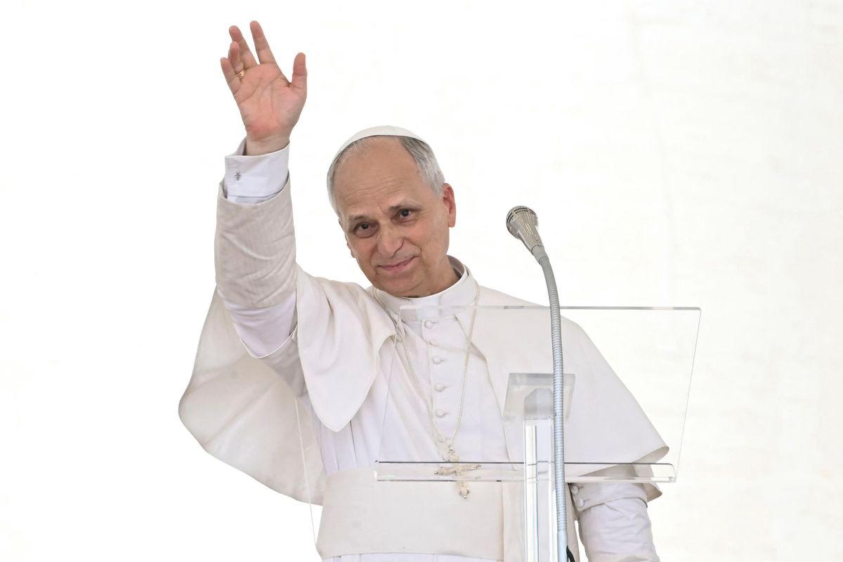 Pope Leo XIV waves as he addresses the crowd for the Angelus prayer in The Vatican on June 15, 2025. (Photo by Filippo MONTEFORTE / AFP)