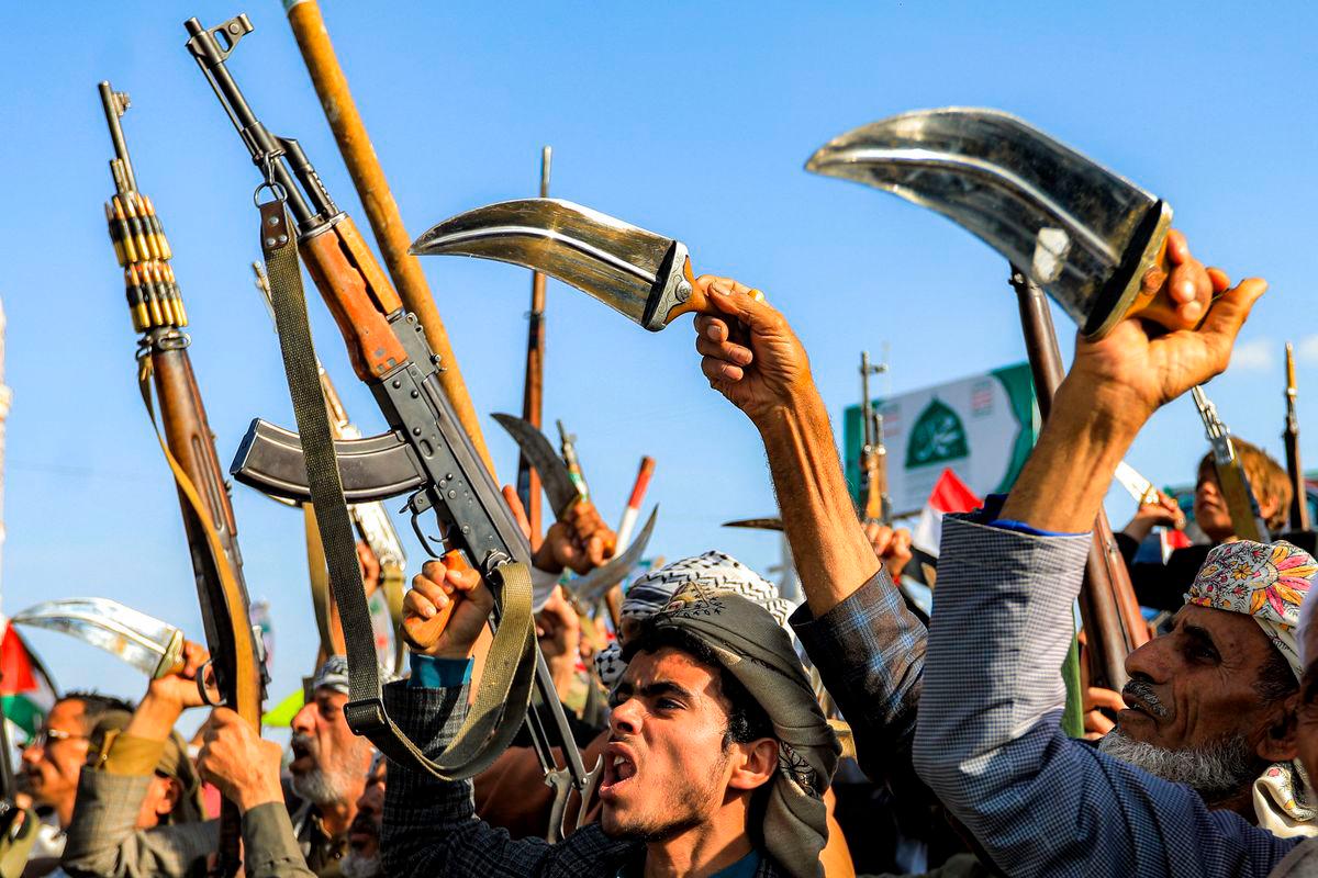Supporters of Yemen’s Huthis display weapons and chant slogans as they gather for a rally condemning Israel and in support of Palestinians, near the Saleh Grand Mosque in the Huthi-held capital Sanaa on October 3, 2025. (Photo by Mohammed HUWAIS / AFP)