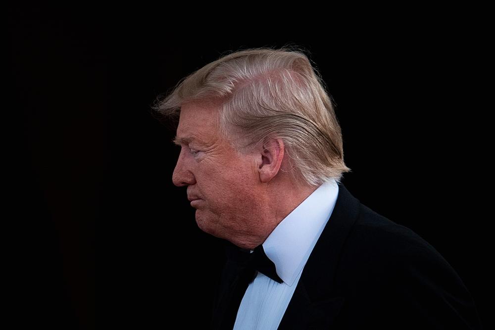 US President Donald Trump waits for Australian Prime Minister Scott Morrison and his wife, Jennifer Morrison, for an Official Visit with a Official Visit with a State Dinner at the North Portico of the White House in Washington, DC, September 20, 2019. - AFP