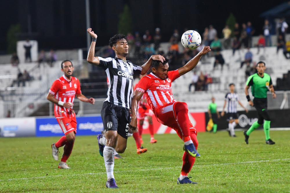 KUALA TERENGGANU, May 8 - Terengganu FC II player, Engku Muhammad Nur Shakir Engku Yacob (left) pushes Kelantan FC player, Mohd Arip Amiruddin (right) during the Malaysia Premier League 2022 match at the Sultan Ismail Nasiruddin Shah Stadium. BERNAMAPIX