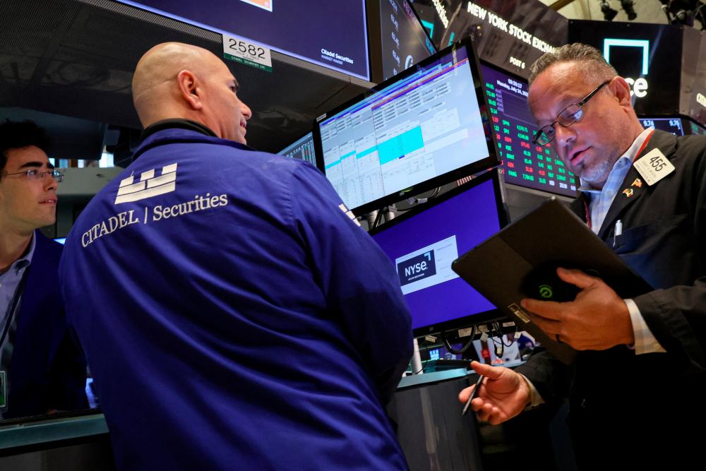 Traders working on the floor of the New York Stock Exchange on Monday, July 24, 2023. – Reuterspic