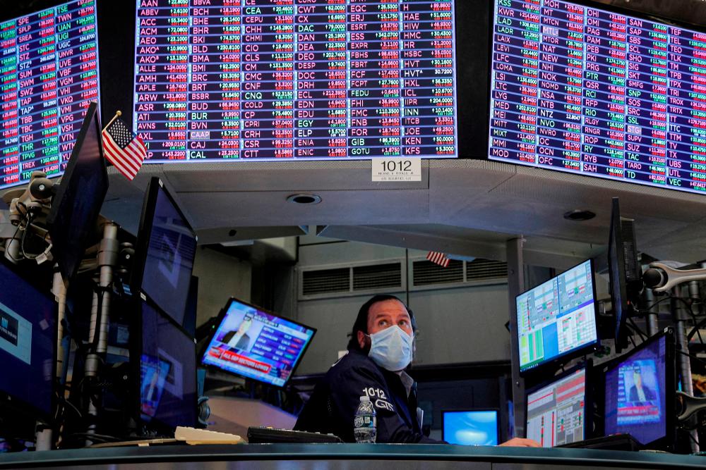 A specialist trader inside a booth on the floor of the New York Stock Exchange. Some money managers are looking for opportunities in stocks they believe may have grown cheap after a weeks-long selloff. REUTERSpix
