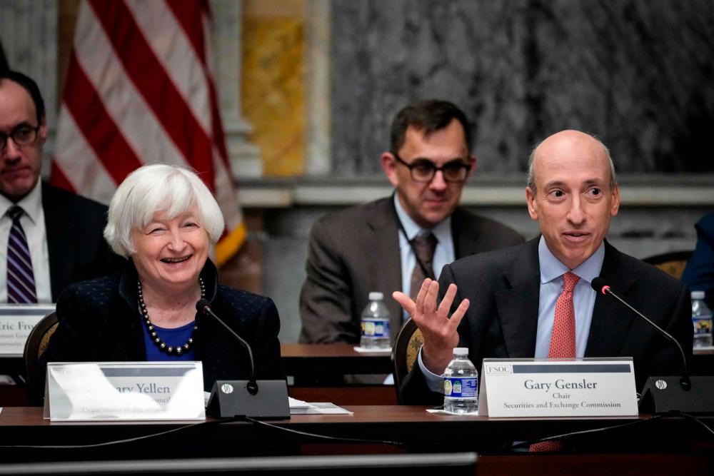 Yellen (left) looks on as US Securities and Exchange Commission chairman Gary Gensler speaks during a meeting of the Financial Stability Oversight Council at the US Department of Treasury on Thursday. – AFPpic