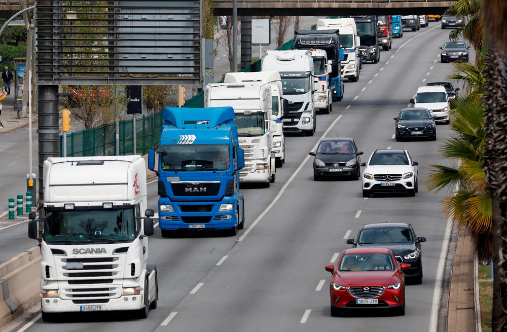 Truck drivers protest against the rise of fuel prices and against their working conditions with a slow march along the B-20 road, in Barcelona, Spain, March 21, 2022. REUTERSpix