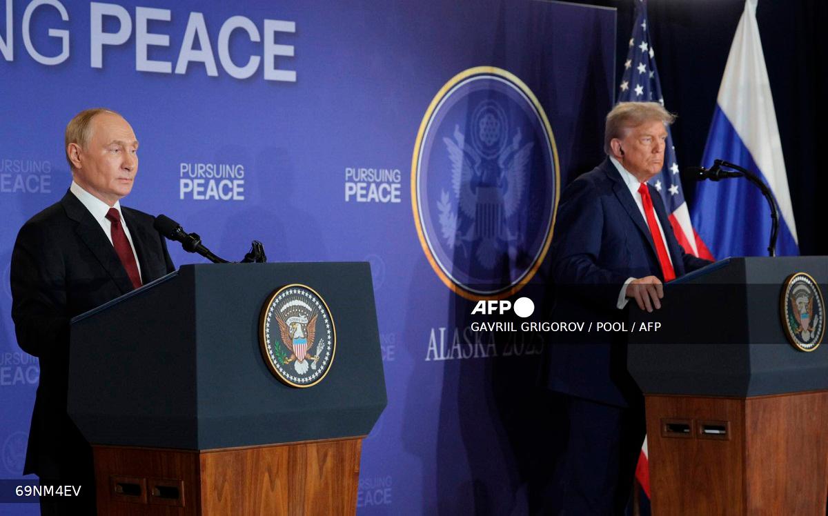 In this pool photograph distributed by the Russian state agency Sputnik, US President Donald Trump (R) and Russian President Vladimir Putin hold a joint press conference following a US-Russia summit on Ukraine at Joint Base Elmendorf-Richardson in Anchorage, Alaska, on August 15, 2025. - Gavriil GRIGOROV / POOL / AFP