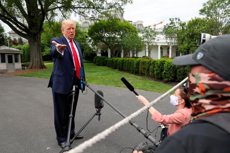 U.S. President Donald Trump speaks to reporters as he departs the White House for travel to Michigan during the coronavirus disease (Covid-19) outbreak in Washington, U.S. May 21, 2020. — Reuters