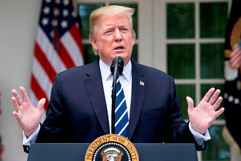 US President Donald Trump speaks in the Rose Garden of the White House on May 22, 2019, in Washington, DC. Trump Wednesday denied opposition charges of a ‘cover-up’ related to the Russia election meddling probe, urging Democrats to end what he called “phony investigations”. — AFP