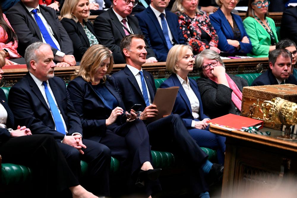 Hunt and Truss (third and fourth from left, respectively) in the House of Commons, in London on Monday, Oct 17. – UK Parliament pic via Reuters