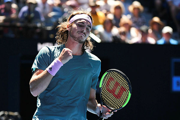 Greece’s Stefanos Tsitsipas reacts after a point against Spain’s Roberto Bautista Agut during their men’s singles quarter-final match on day nine of the Australian Open. — AFP