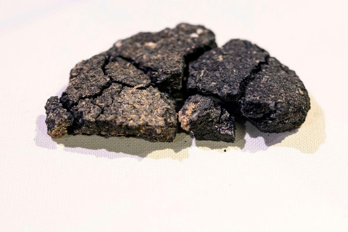 This photograph shows Kulluoba bread, a 5,000 years old bread unearthed in an archeological excavation in Eskisehir province, in central Turkey, exhibited at Eskisehir ETI archeology museum, on May 23, 2025. AFPpix