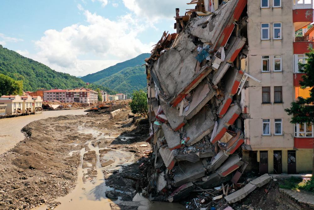 A view shows a partially collapsed building, as the area was hit by flash floods that swept through towns in the Turkish Black Sea region, in the town of Bozkurt, in Kastamonu province, Turkey, August 14, 2021. Picture taken with a drone. — Reuters
