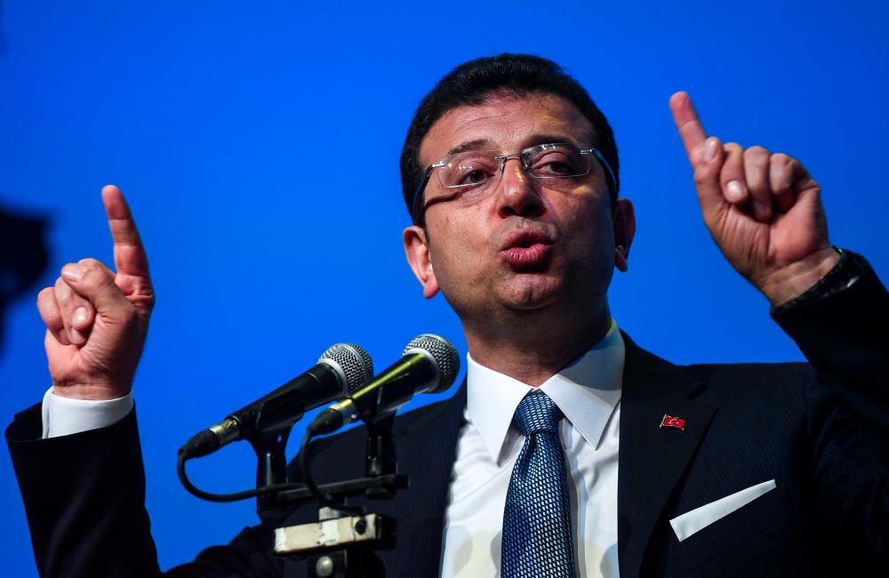 Turkish opposition candidate for the Istanbul re-run for the mayor's election, Ekrem Imamoglu gestures as he delivers a speech on stage during his repeated political campaign coordination meeting on May 22, 2019 in Istanbul. Istanbul's deposed mayor Ekrem Imamoglu said Wednesday that no one believed the lies used to overturn his recent election and called on voters to correct this great shame in next month's re-run. He accused President Recep Tayyip Erdogan's ruling party of peddling lies and excuses to overturn his narrow victory in the mayoral election in March. — AFP