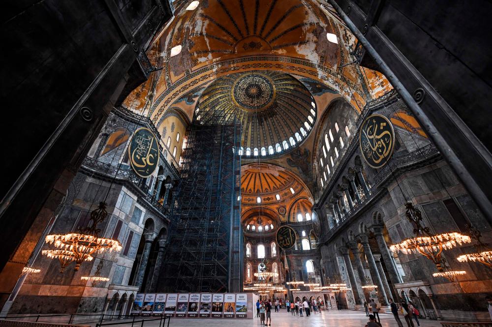 Tourists visit the inside of Hagia Sophia on July 10, 2020, in Istanbul, before a top Turkish court revoked the sixth-century Hagia Sophia’s status as a museum, clearing the way for it to be turned back into a mosque. — AFP