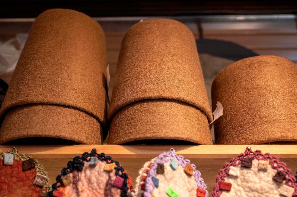 Symbolic hats “Sikke”, worn by whirling dervishes, are displayed on the shelf of a workshop in Konya on December 17,2023/AFPpix