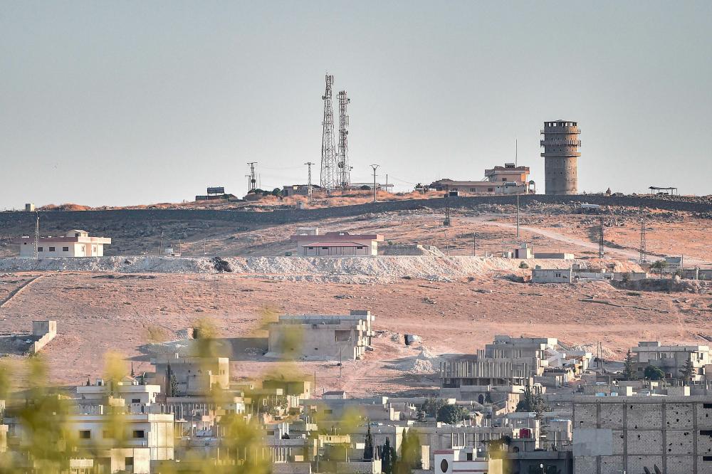 This picture taken on Oct 12, 2019 from Turkey near the town of Suruc shows a US observation post near the Syrian town of Kobani Kobane where the Pentagon said an explosion occurred “within a few hundred meters”. — AFP