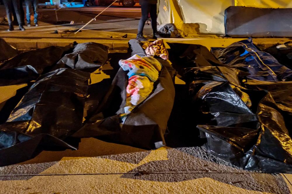 Body bags are pictured outside the state hospital of Hatay on February 8, 2023, as rescuers still race to save survivors trapped under debris in freezing weather after the massive earthquake that has killed over 12,000 people in Turkey and Syria./ AFPPIC