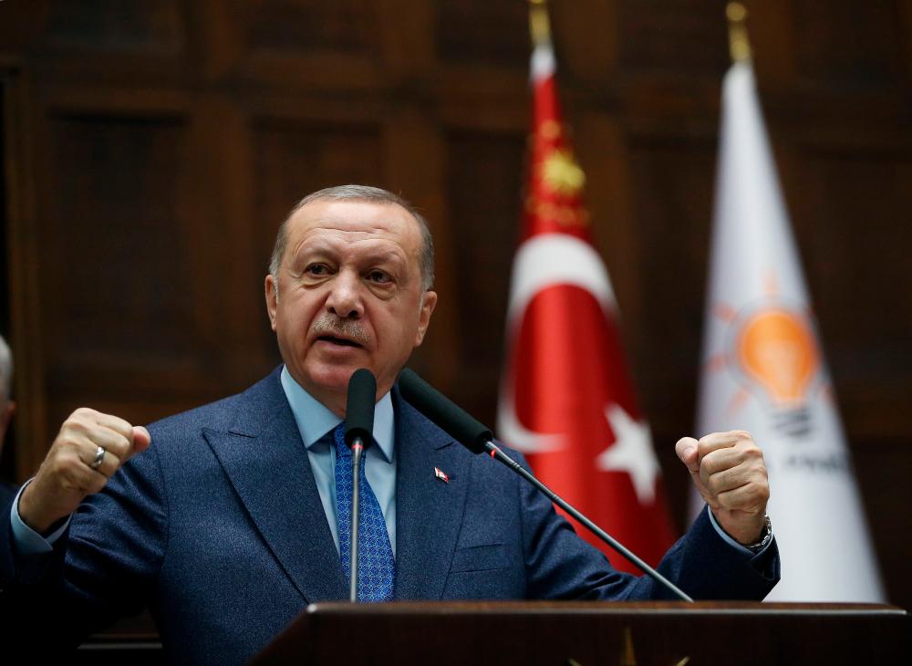 Turkish President Tayyip Erdogan addresses members of his ruling AK Party during a meeting at the parliament in Ankara, Turkey, March 11, 2020. - Reuters