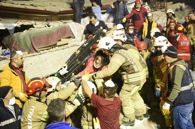 A Turkish woman being rescued at the site of a building that collapsed in Istanbul’s Kartal district — AFP
