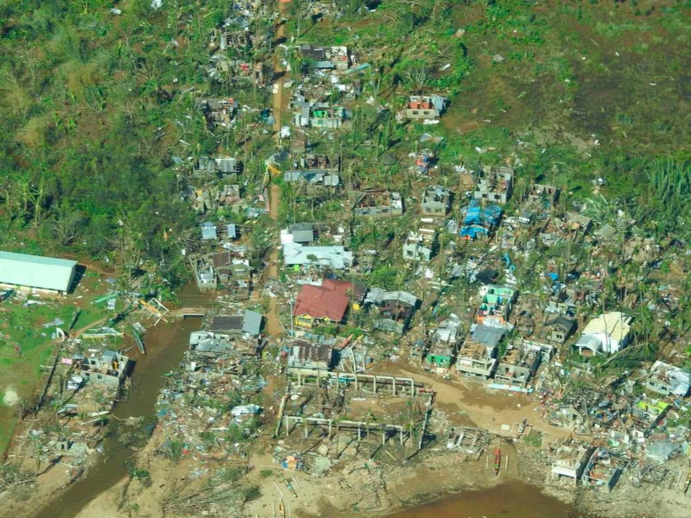 Aerial view showing damaged houses in Surigao City, Surigao Del Norte Province, Philippines, December 17, 2021. Philippine Coast Guard/Handout via Reuters. REUTERSPix