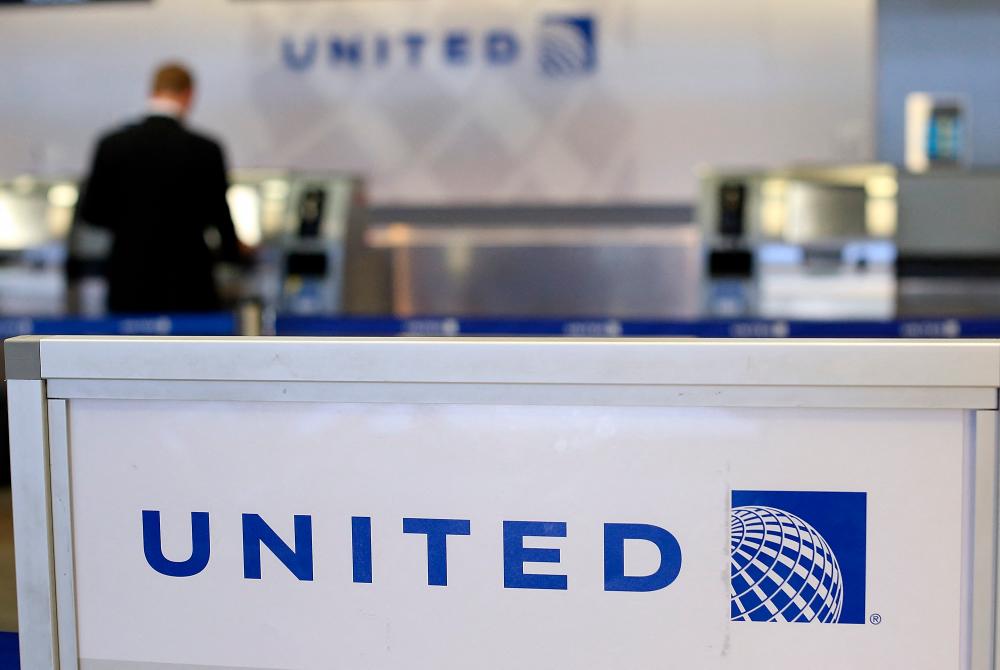 United Airlines ticket counter at San Francisco International Airport. The US carrier plans to acquire 270 new planes consisting of 200 Boeing aircraft and 70 Airbus jets. – AFPPIX
