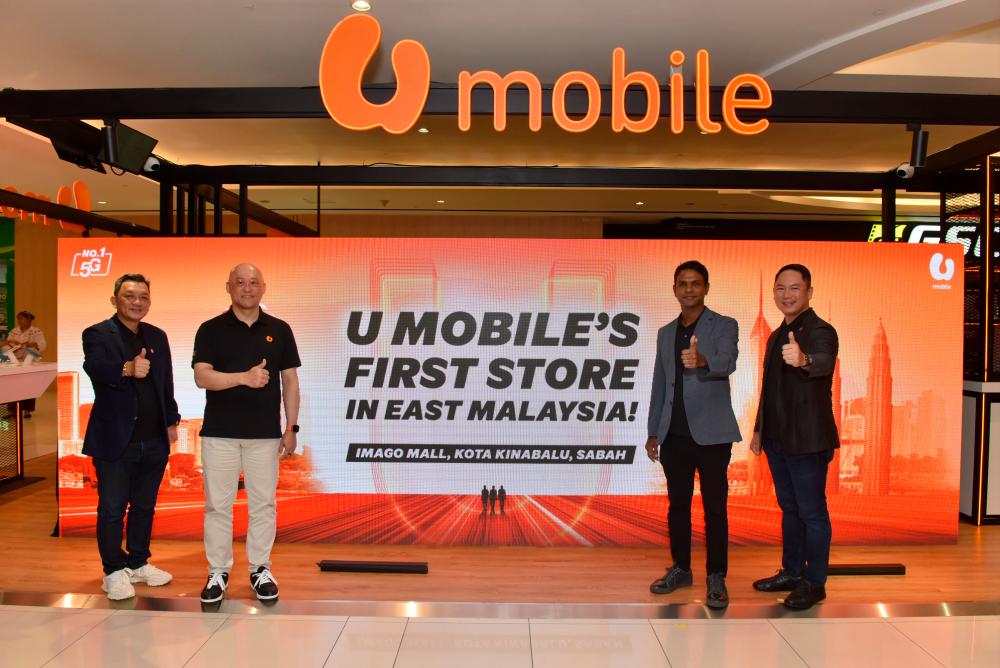 From left: U Mobile chief sales officer Alex Tan Kok Leong, CEO Wong Heang Tuck, Navin and chief technology officer Woon Ooi Yuen at the launch of its first store in Sabah.