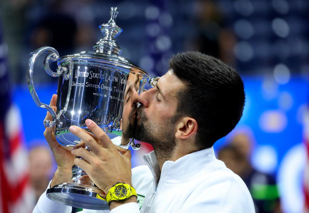 Tennis - US Open - Flushing Meadows, New York, United States - September 10, 2023Serbia's Novak Djokovic celebrates with the trophy after winning the US Open REUTERSPIX