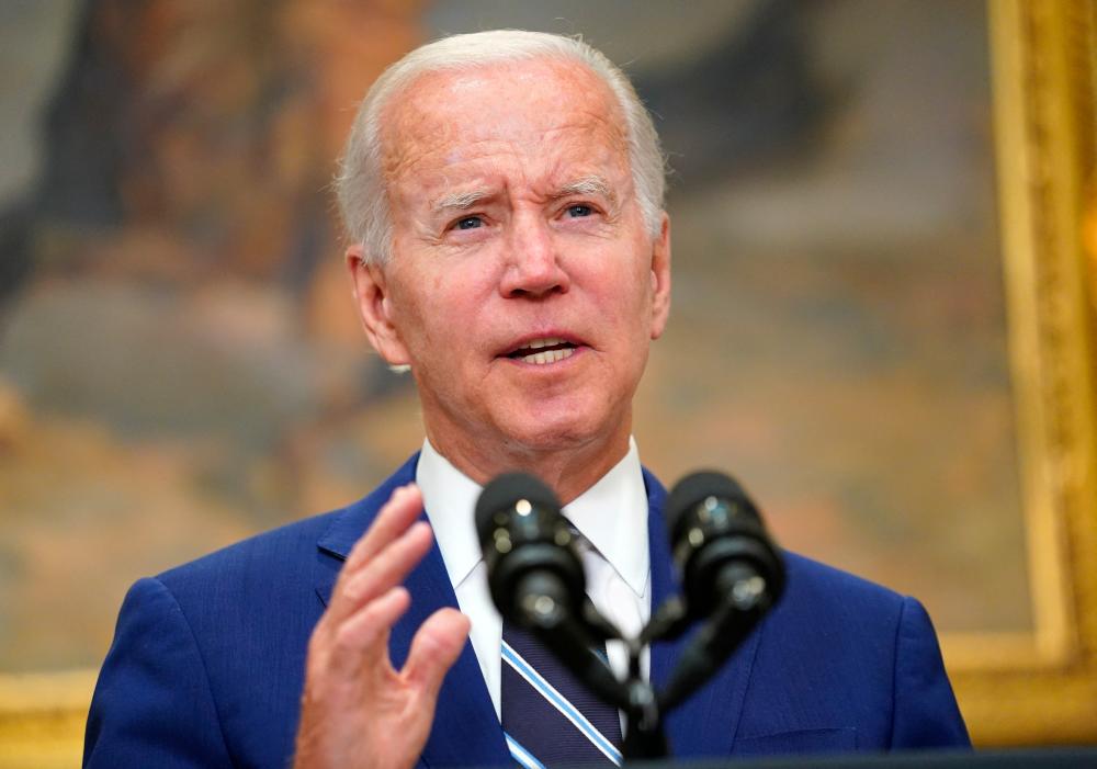 Biden says a decision on whether to pause a federal petrol tax could come this week. REUTERSpix