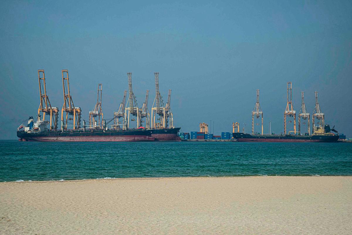 Tankers are seen at the Khor Fakkan Container Terminal along the Strait of Hormuz, a waterway through which one-fifth of global oil output passes on June 23, 2025. (Photo by Giuseppe CACACE / AFP)