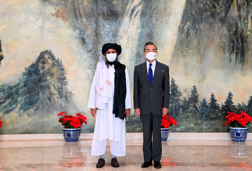 Chinese State Councilor and Foreign Minister Wang Yi meets with Mullah Abdul Ghani Baradar, political chief of Afghanistan’s Taliban, in Tianjin, China July 28, 2021. -Li Ran/Xinhua via Reuters
