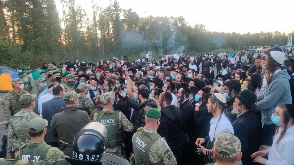 This handout picture provided by the press service of Ukraine’s border guard service on Sept 16, 2020 shows Jewish pilgrims stuck between Ukrainian and Belarusian border crossings. — AFP