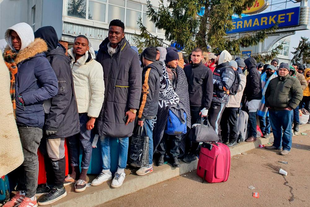 Foreigners wait to go to Poland at the Shegyni Ukrainian border post on March 01, 2022. Hundreds of foreigners, mainly students from Africa, Asia and the Middle East who have been queueing for days in vain, hoping to go to Poland, but they say the Ukrainian border forces deny them the right to go through, while Ukrainian families can. AFPpix