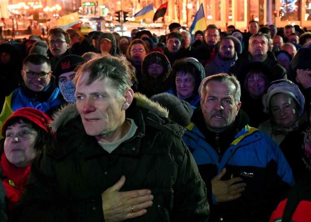 People attend a rally on the sixth anniversary of the Euromaidan beginning in downtown Kiev on Nov 21. — AFP