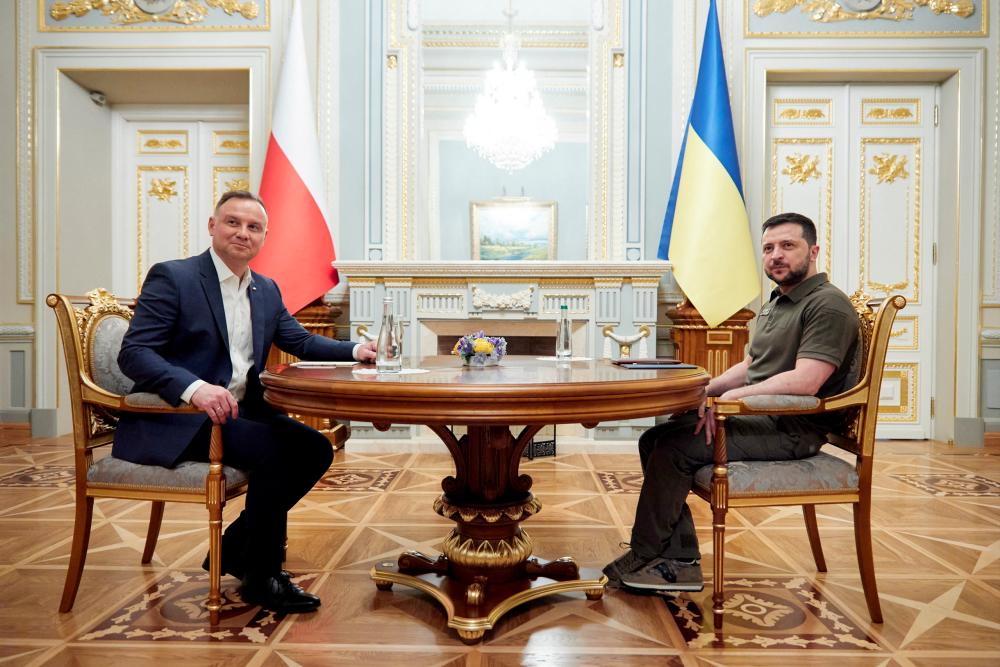 Ukraine's President Volodymyr Zelenskiy and Poland's President Andrzej Duda attend a meeting after a parliament session, as Russia's attack on Ukraine continues, in Kyiv, Ukraine May 22, 2022. Ukrainian Presidential Press Service/Handout via REUTERSpix